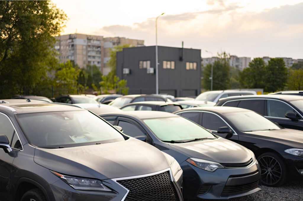 An image showing rows of used cars at a dealership